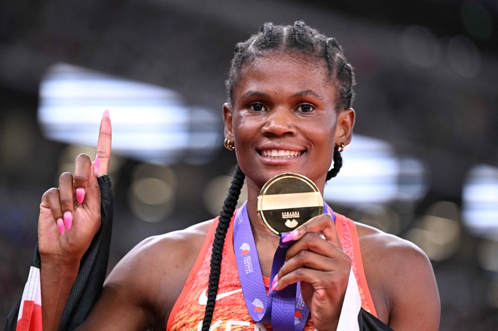 Gold medallist Kenya's athlete Lilian Odira celebrates after winning the women's 800m final during the World Athletics Championships in Tokyo on September 21, 2025. (Photo by Kirill Kudryavtsev / AFP)