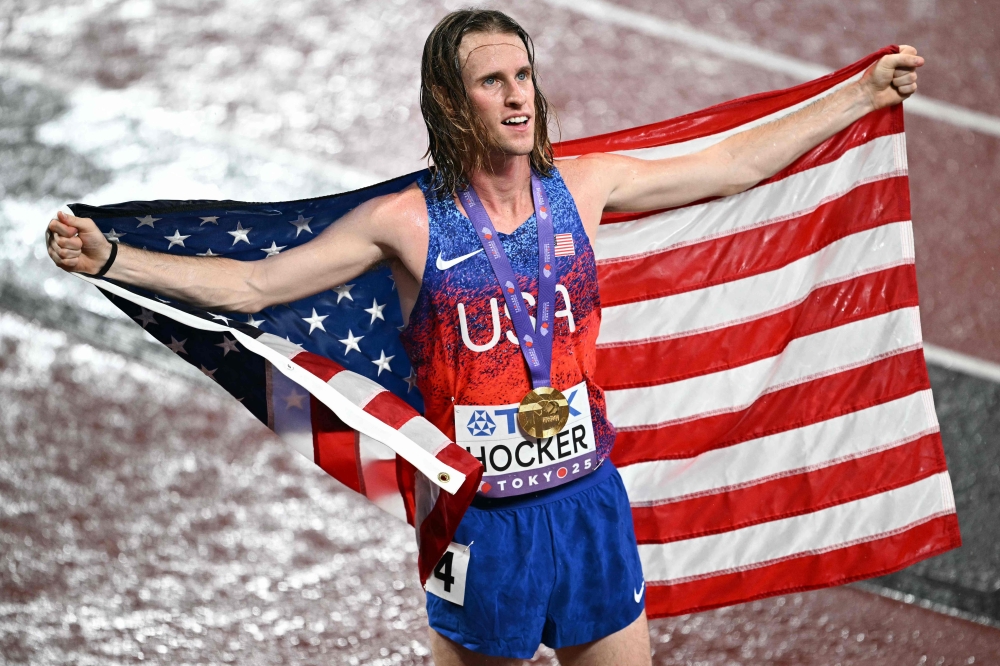 US' athlete Cole Hocker celebrates winning the men's 5000m final during the World Athletics Championships in Tokyo. (Photo by Philip Fong / AFP)