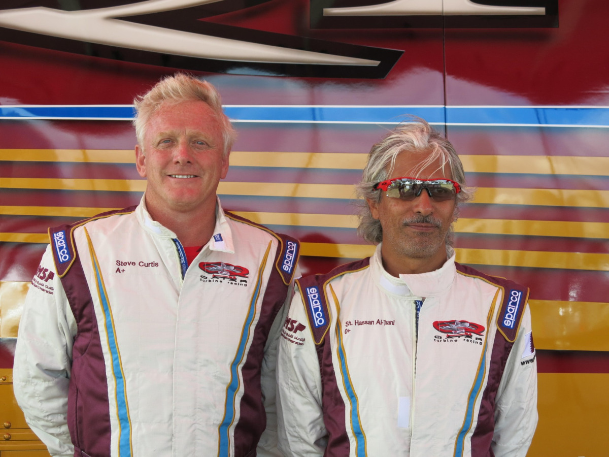 Qatar’s Sheikh Hassan and his partner Steve Curtis pose for a photo. 