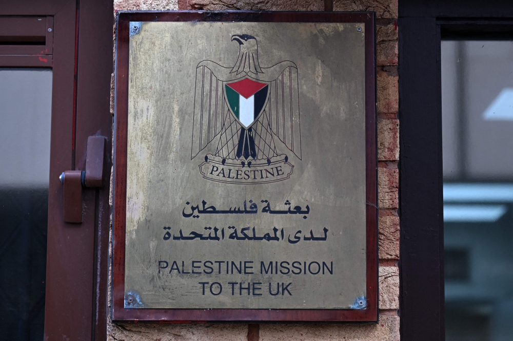 A sign is seen outside the Palestine Mission to the UK on September 21, 2025 in west London. (Photo by Justin Tallis / AFP)