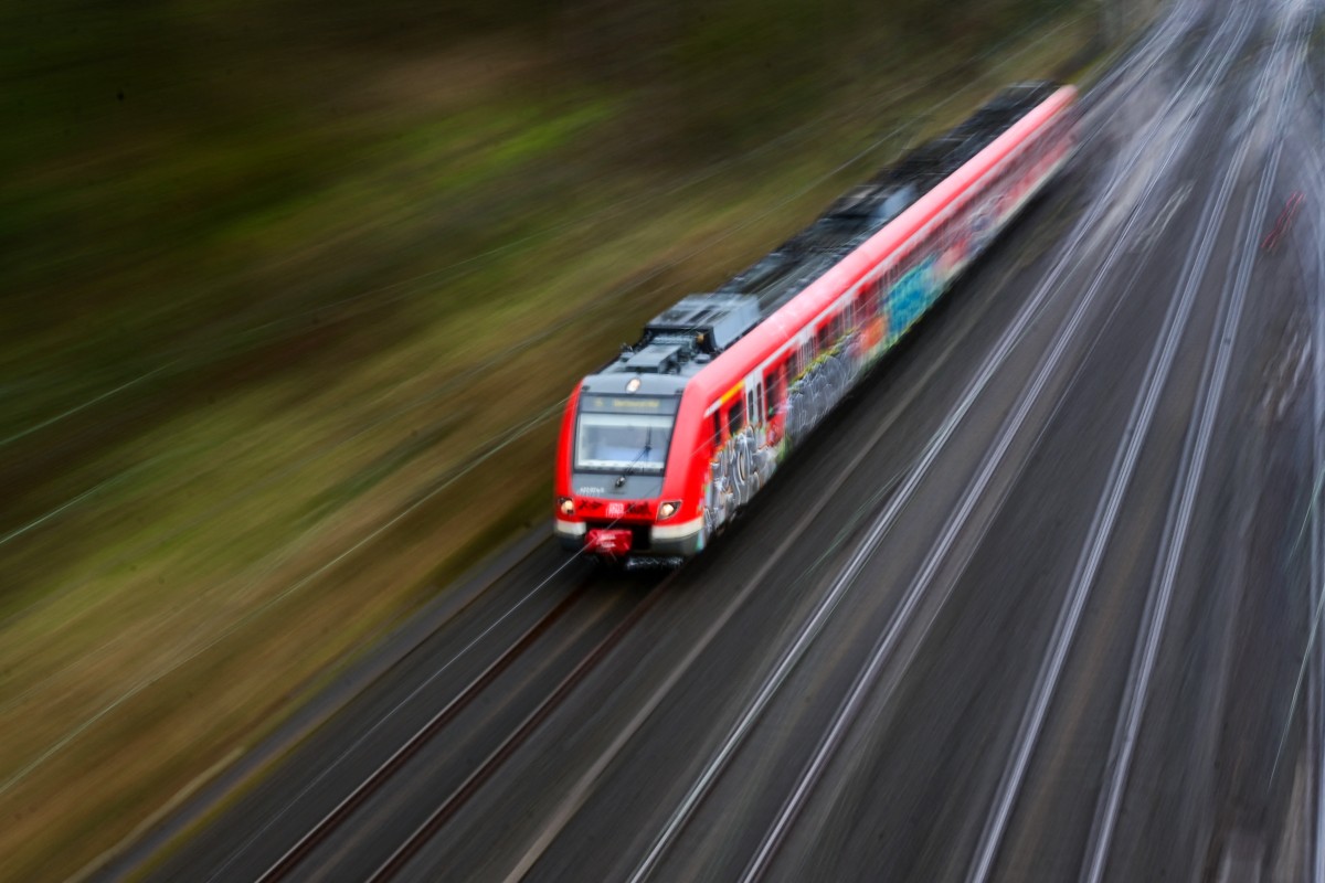 A regional train of German railway operator Deutsche Bahn DB drives past the freight station in Hagen, western Germany on March 11, 2024. Photo by Ina FASSBENDER / AFP