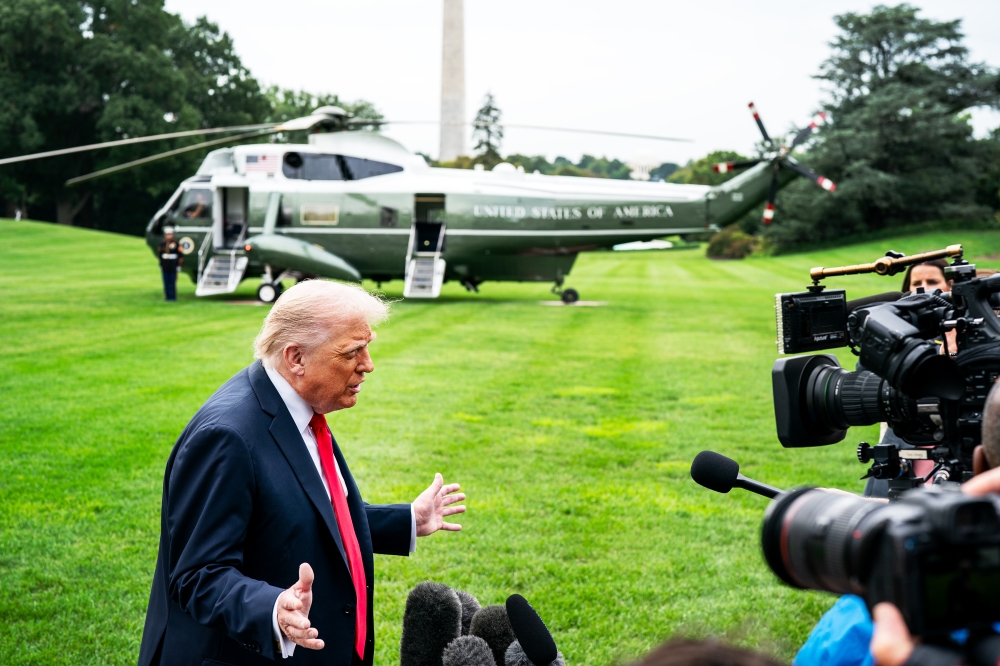 US President Donald Trump speaks with the press at the White House. (Photo by Demetrius Freeman/The Washington Post)