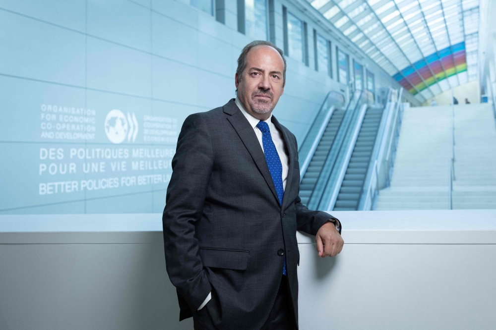 Chief Economist and G20 Finance Deputy Director for OECD, Alvaro Santos Pereira at the OECD headquarters in Paris on September 22, 2025. Photo by Joel Saget / AFP