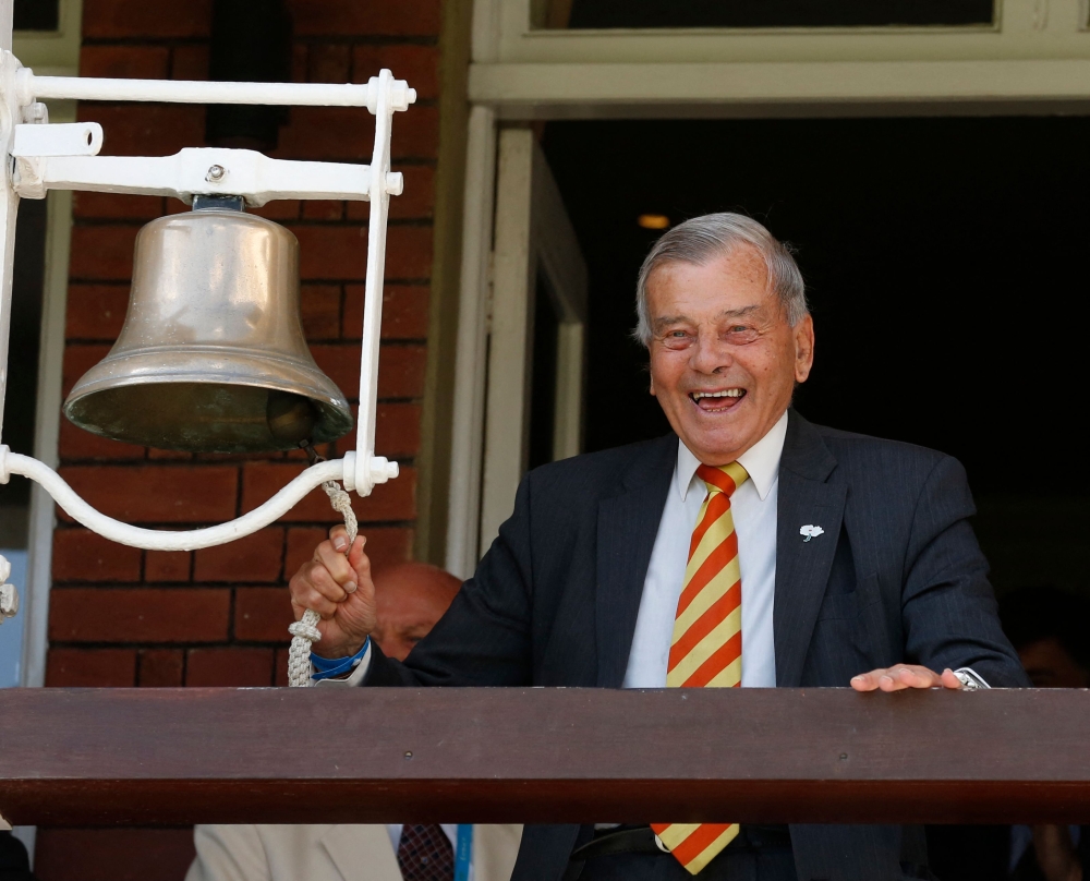 File: Retired umpire Dickie Bird rings the five minute bell during play on the first day of the first cricket Test match between England and New Zealand at Lord's cricket ground in London on May 21, 2015. (Photo by Ian Kington / AFP) 