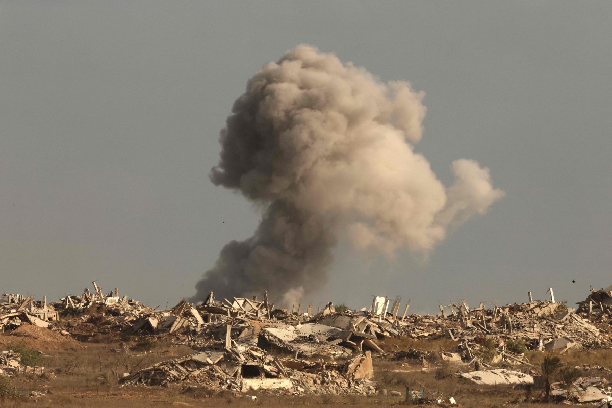 This picture taken from a position at Israel's border with the Gaza Strip shows smoke billowing during an Israeli strike on the besieged Palestinian territory on September 25, 2025. (Photo by Jack GUEZ / AFP)
