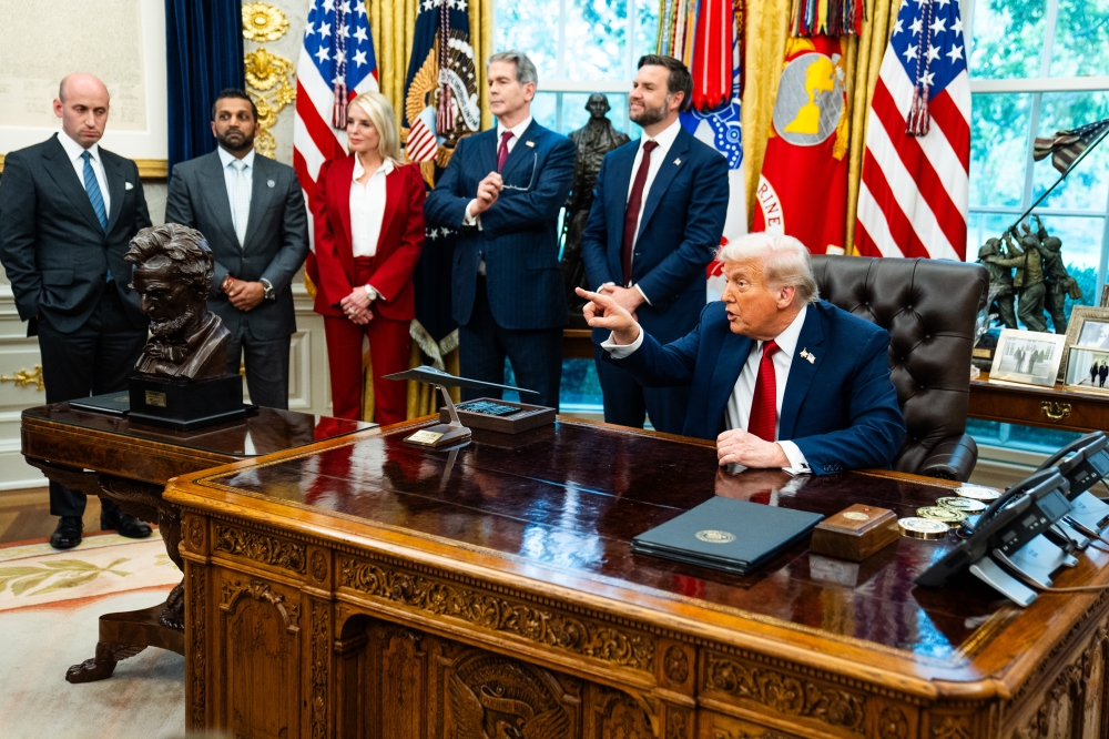 US President Donald Trump speaks with the press during the signing of executive orders in the Oval Office, in Washington DC, on September 25, 2025. (Photo by Demetrius Freeman/The Washington Post)