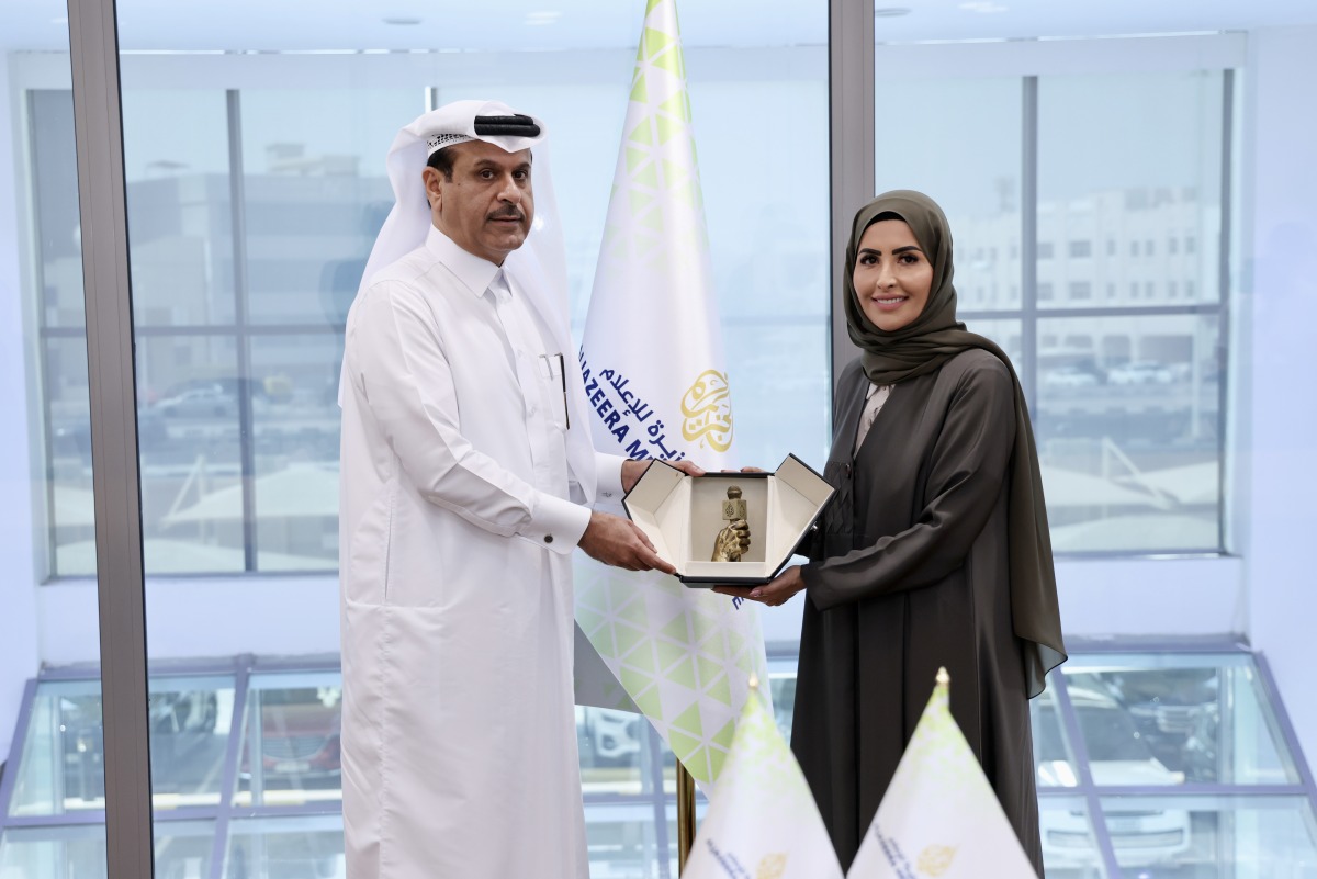 Director of Al Jazeera Media Institute, Eman Al-Amri; and Senior Executive Vice President - Group Human Capital, QNB Group, Abdullah Nasser Al Khalifa, at the agreement signing ceremony. 
