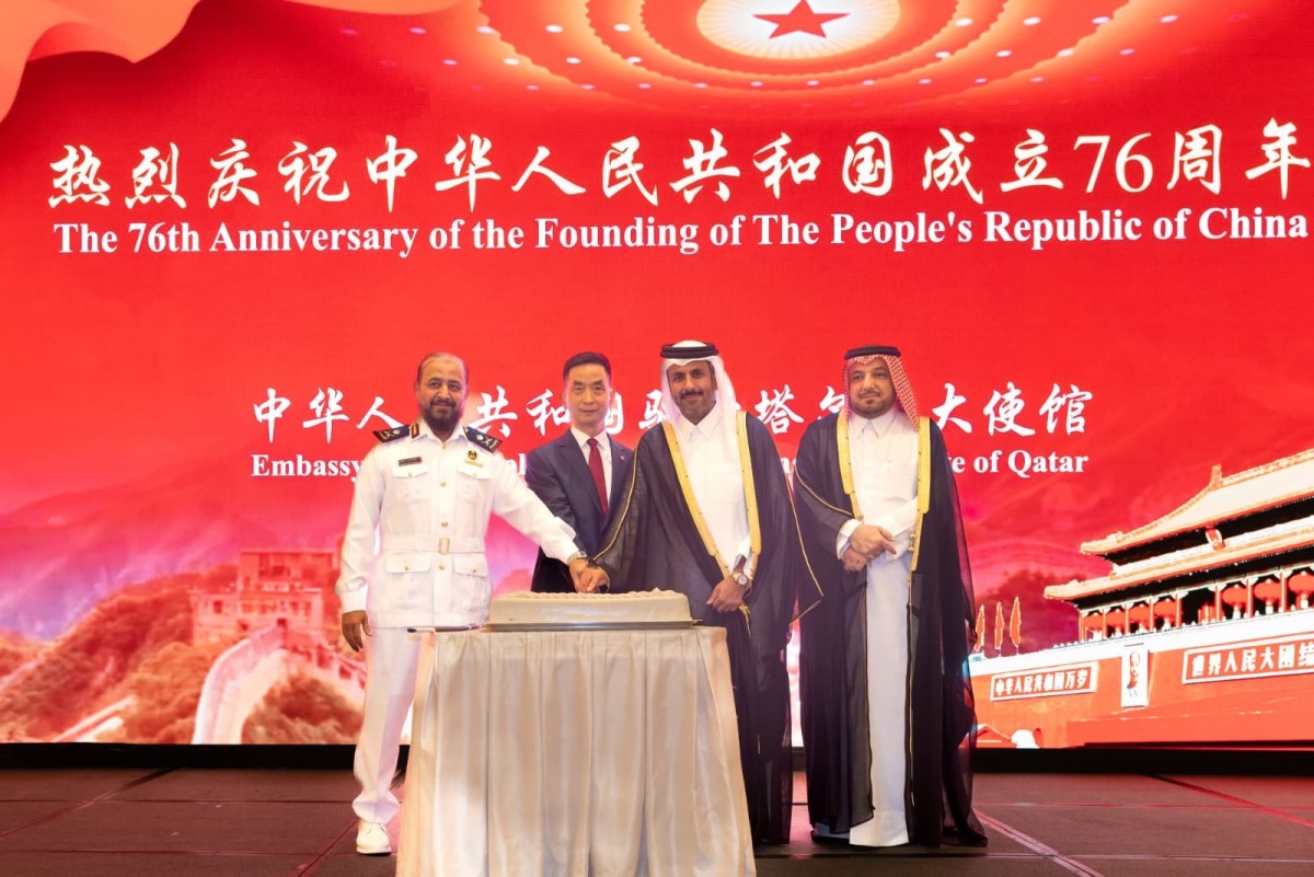 Minister of Commerce and Industry H E Sheikh Faisal bin Thani bin Faisal Al Thani and Ambassador of China to Qatar H E Cao Xiaolin and other officials cutting a cake to mark 76th anniversary of the founding of the People’s Republic of China.