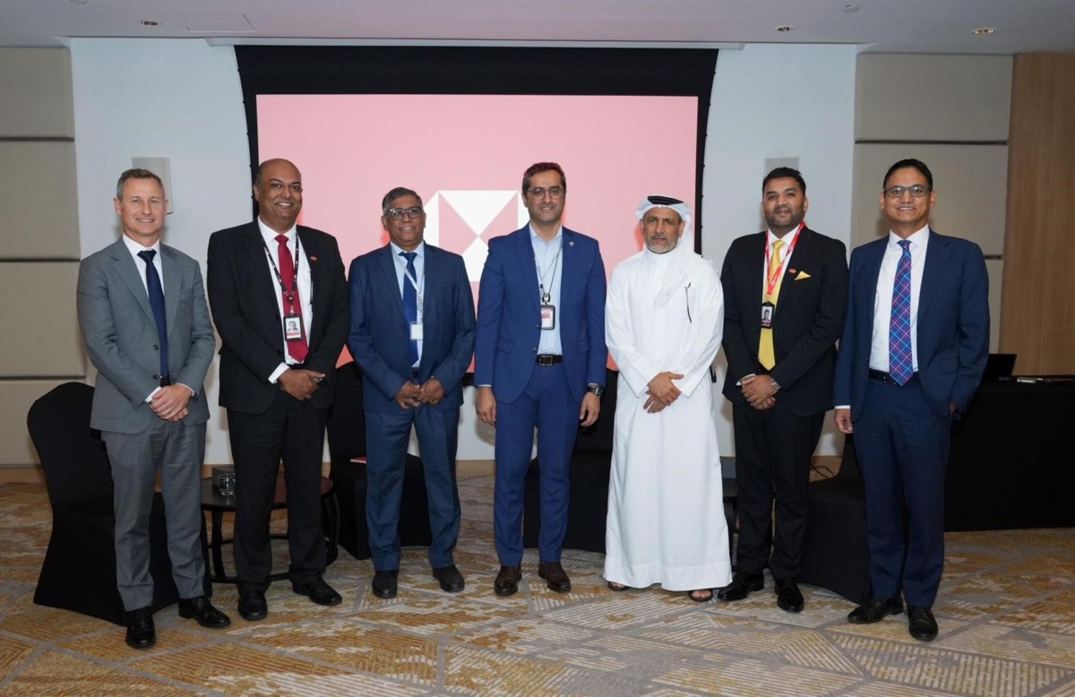HSBC Qatar officials pose for a group photo during the event.