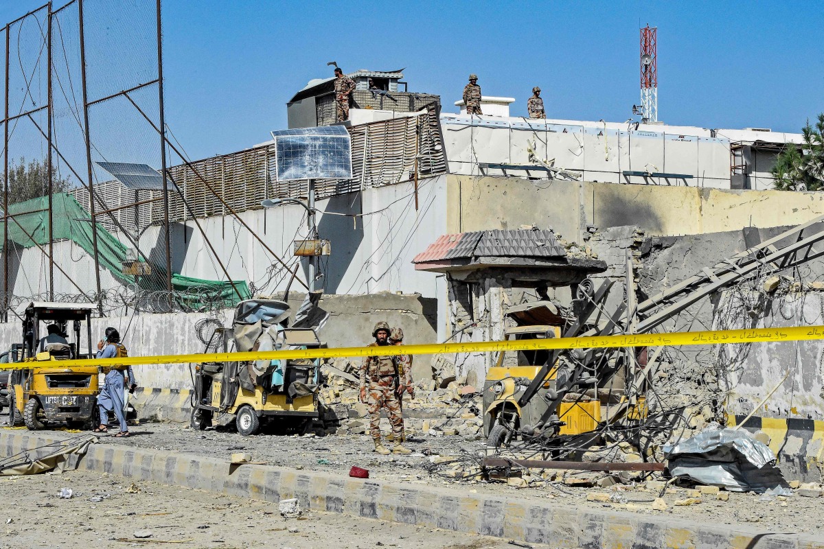 Security personnel inspect an explosion site outside the Frontier Corps (FC) headquarters in Quetta on September 30, 2025. (Photo by Banaras KHAN / AFP)