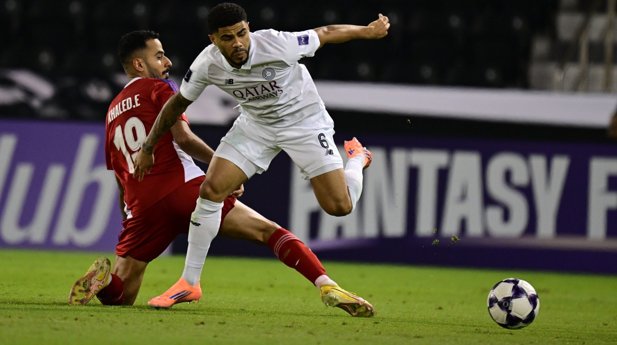 Al Sadd's Paulo Otavio (right) battles for the ball with a Sharjah FC player.