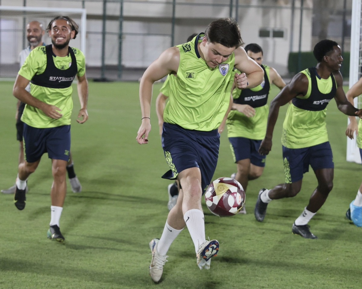 Al Kharaitiyat players take part in a training session.