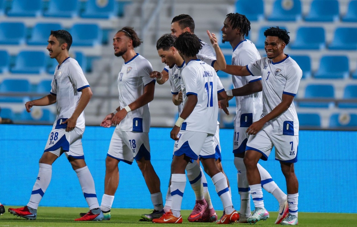 Al Kharaitiyat players celebrate a goal against Al Duhail.