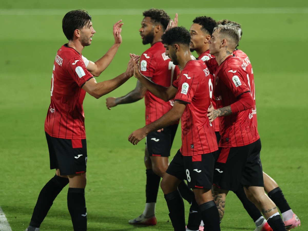 Al Rayyan's Rodrigo Moreno (second right) celebrates with teammates.