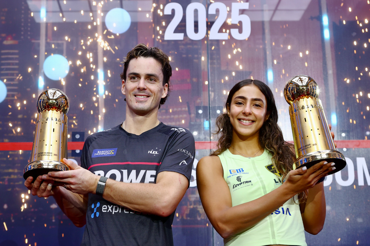 New Zealand’s Paul Coll and Egypt’s Hania El Hammamy celebrate with their trophies.