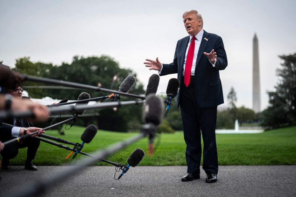 President Donald Trump speaks to reporters at the White House. (Photo by Jabin Botsford/The Washington Post)
