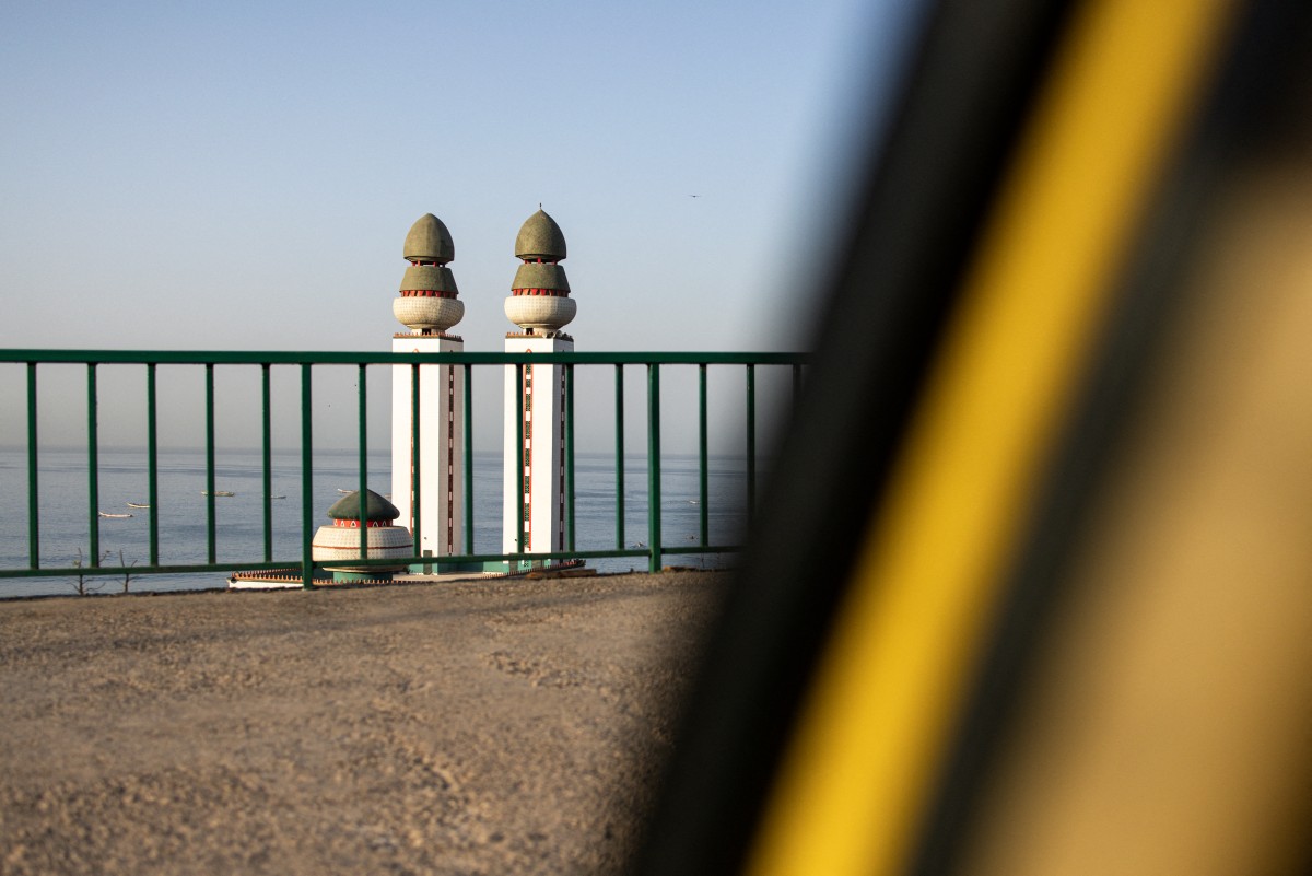 The Mosque of Divinity is pictured along the corniche in Dakar on November 27, 2024. (Photo by JOHN WESSELS / AFP)