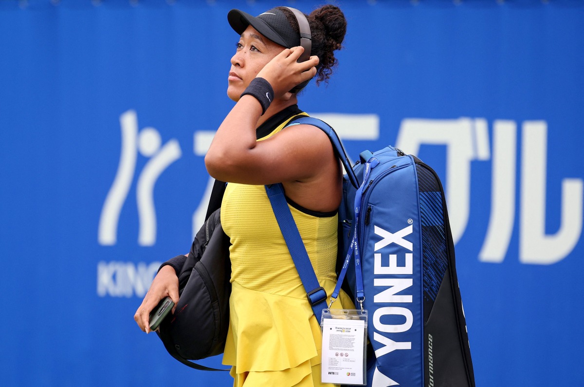 Japan's Naomi Osaka arrives to play against Netherlands' Suzan Lamens during their women's singles match at the Japan Open tennis tournament in Osaka on October 15, 2025. (Photo by PAUL MILLER / AFP)