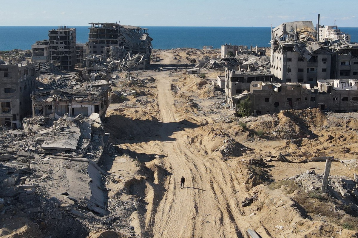 An aerial view shows the Al-Maqussi Towers district, heavily damaged by massive Israeli bombardment over the past two years, in northwestern Gaza City on October 15, 2025 (Photo by AFP)

