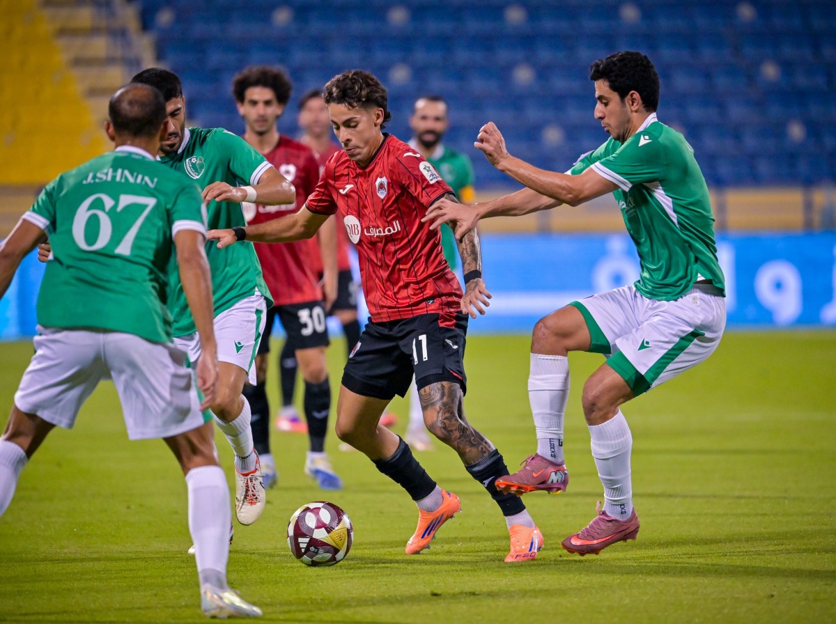 Al Rayyan's Gabriel Pereira is challenged by Al Waab players.