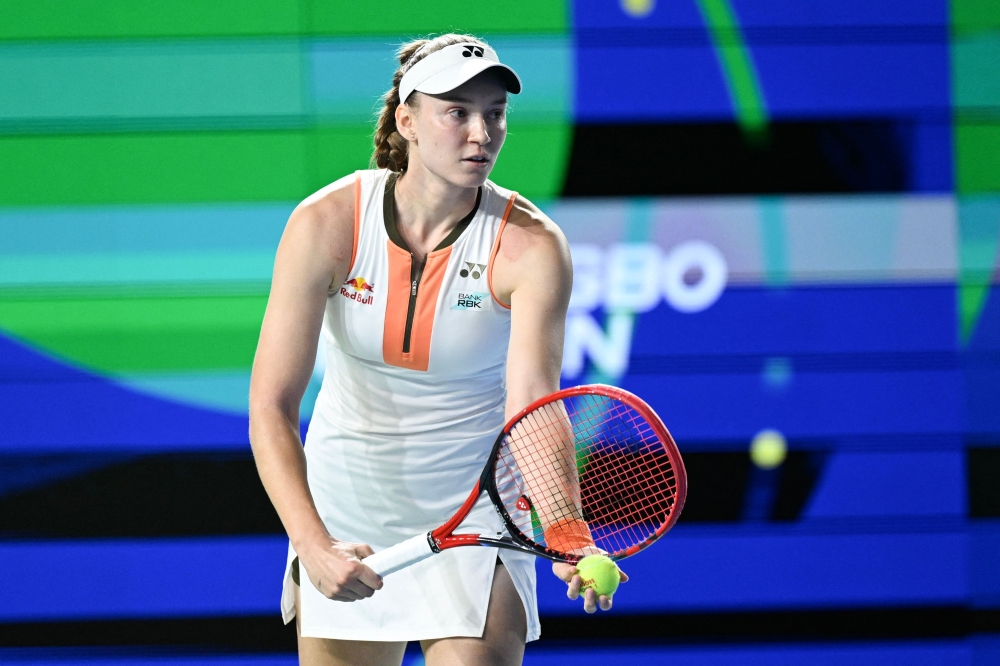 Kazakhstan's Elena Rybakina serves to Russia's Ekaterina Alexandrova during the women's singles final at the WTA Ningbo Open tennis tournament in Ningbo, China on October 19, 2025. (Photo by AFP)
