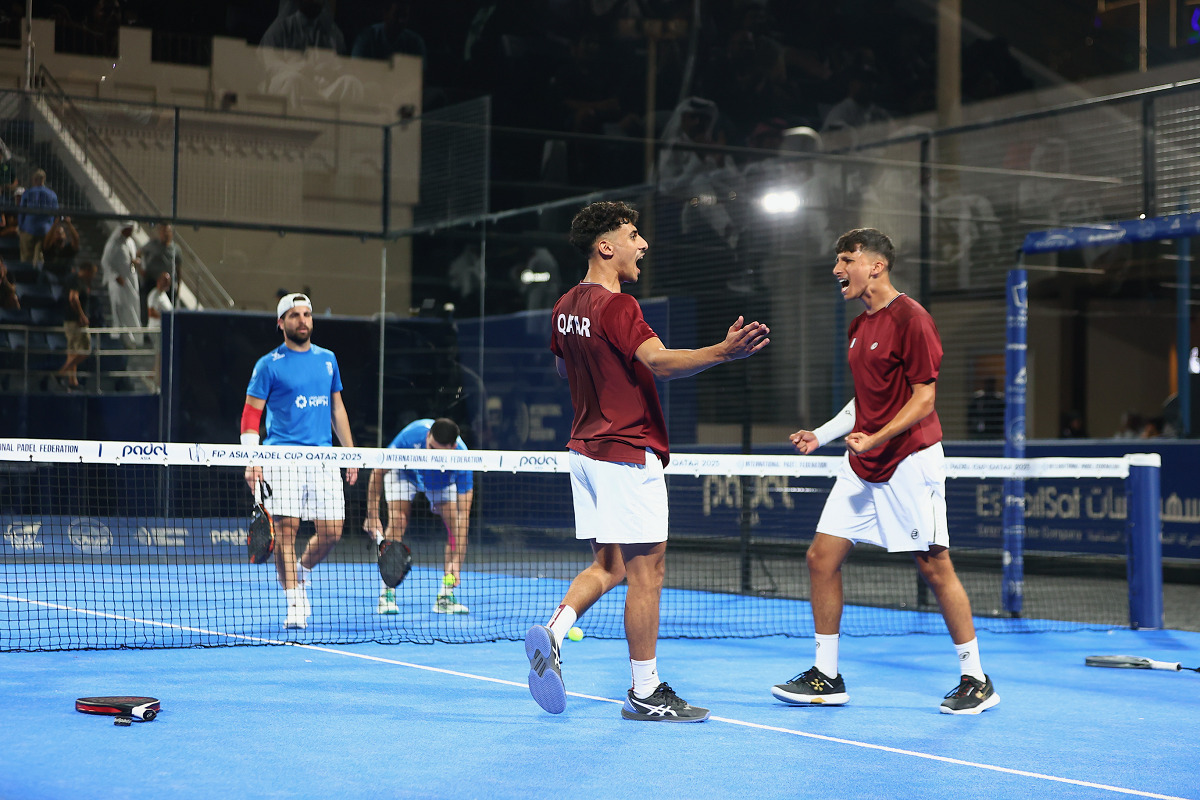 Qatar's players celebrate their victory over Kuwait