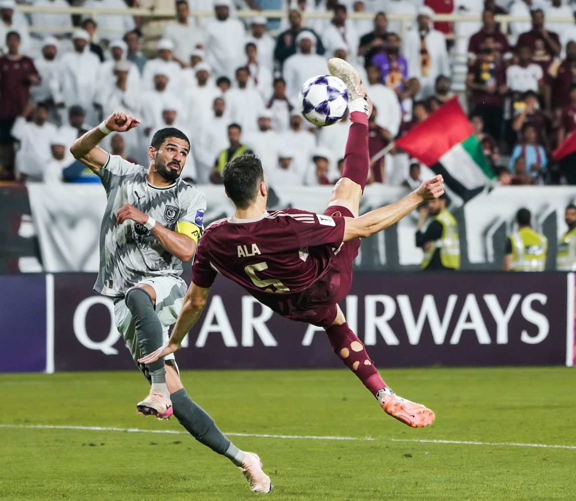 Al Wahda’s Ala Zouhir scores with a spectacular overhead kick.