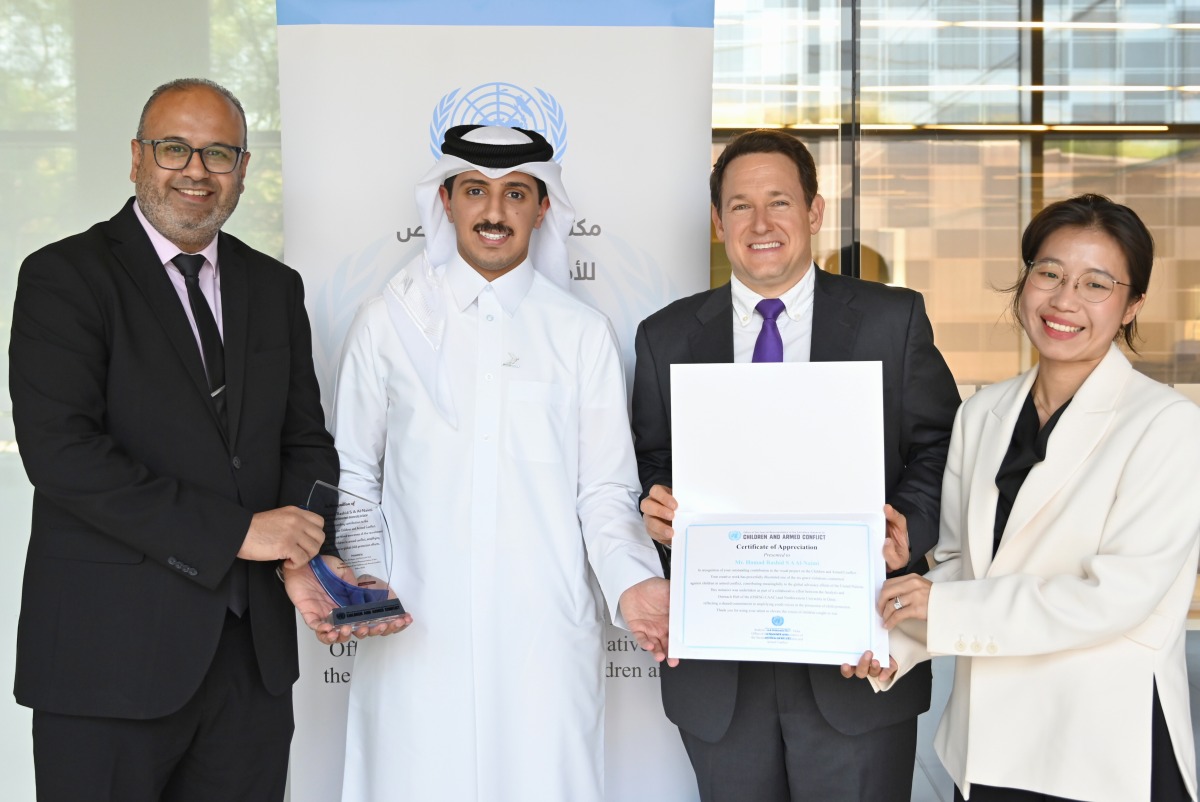 Officials and students at the event.