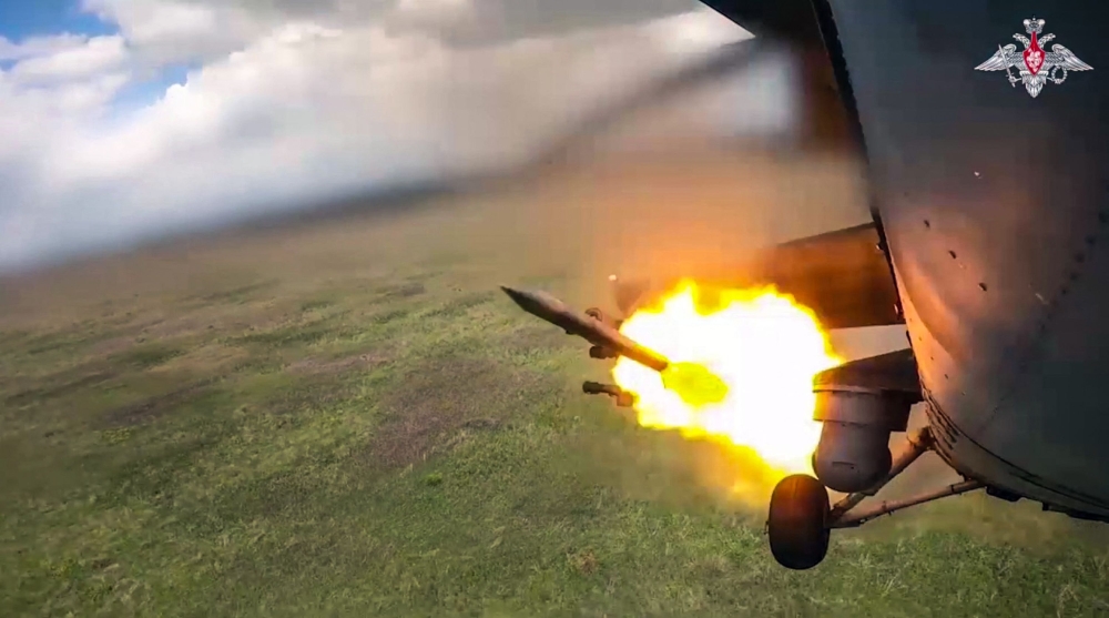 File:  An image taken from a handout footage released by the Russian Defence Ministry on August 21, 2024, reportedly shows a Russian Mi-35m attack helicopter firing rockets on Ukrainian Armed Forces at the border area of Kursk region in Russia. (Photo by Handout / Russian Defence Ministry / AFP)