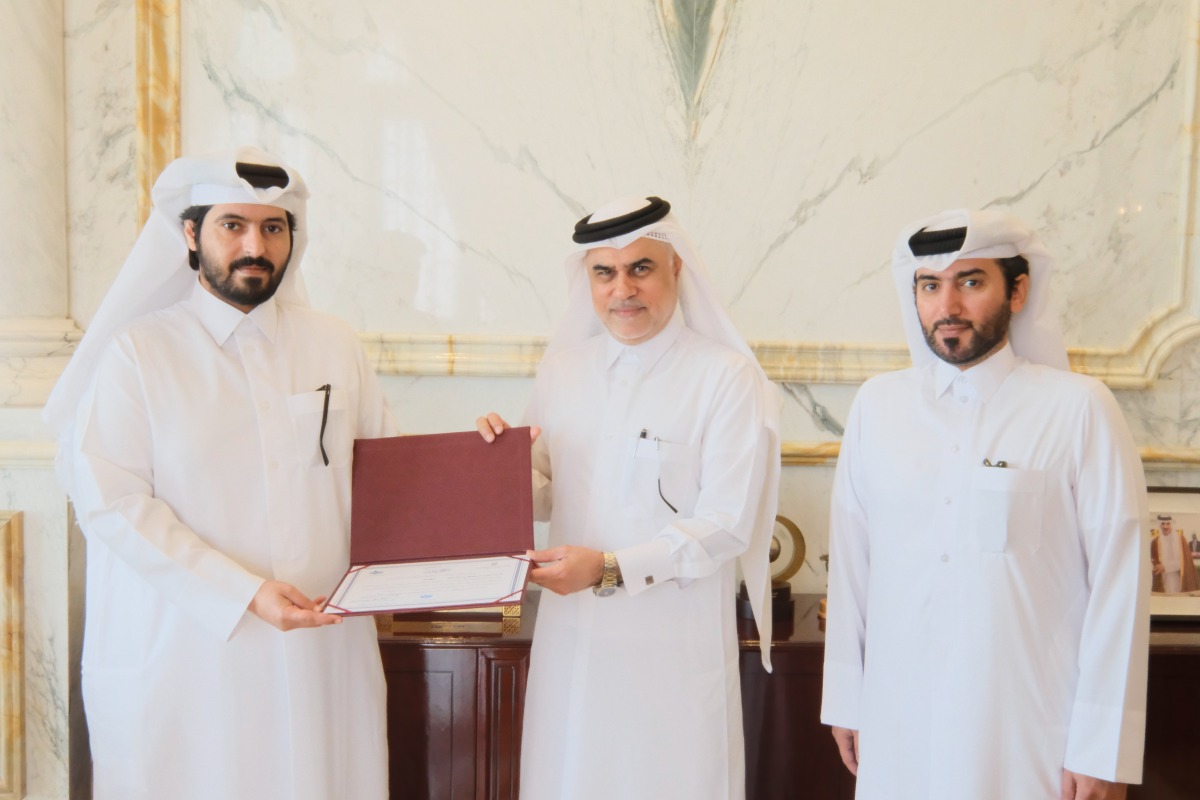 Officials honouring owner of Al Hazm Mall Mohammed Abdul Karim Al-Emadi.
