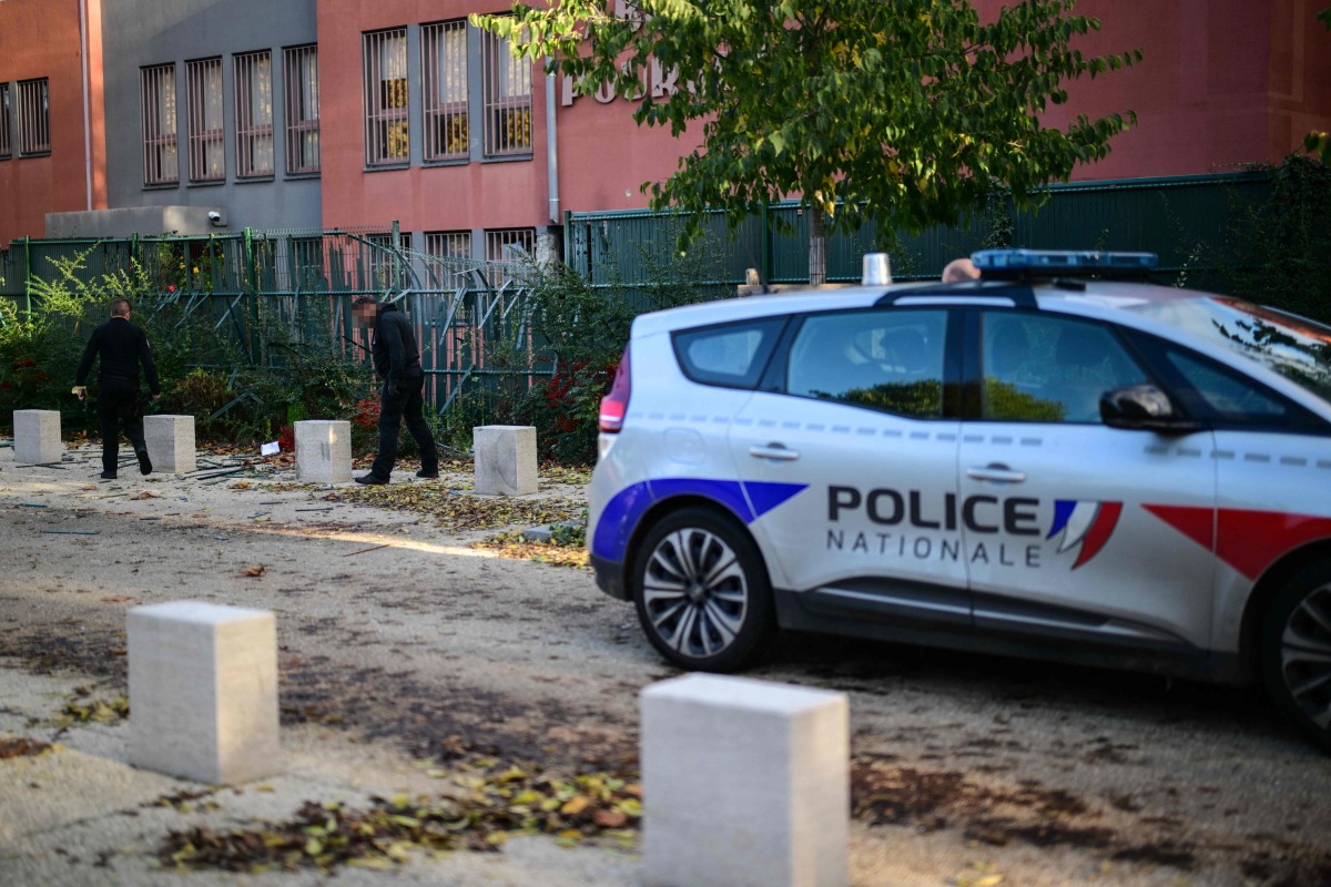 Members of the French Brigade de Recherche et d'Intervention (BRI - Research and Intervention Brigade) police unit check the scene of a robbery at a gold refining laboratory in Lyon, central-eastern France, on October 30, 2025. Photo by OLIVIER CHASSIGNOLE / AFP