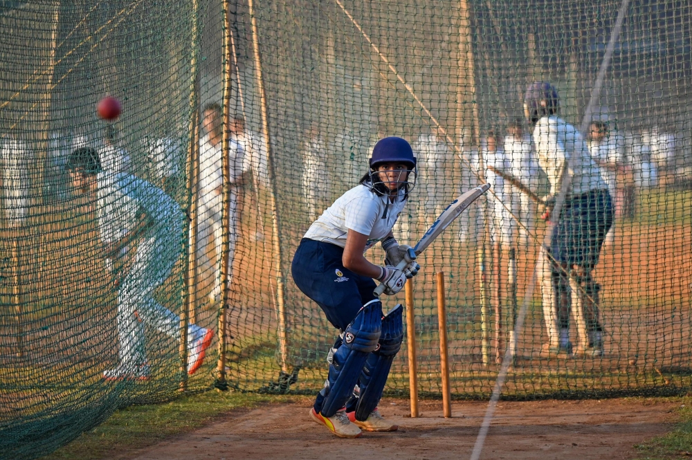 (Files) In this photograph taken on February 14, 2023, a girl attends batting practice session in Shivaji Park in Mumbai. (Photo by Punit Paranjpe / AFP)