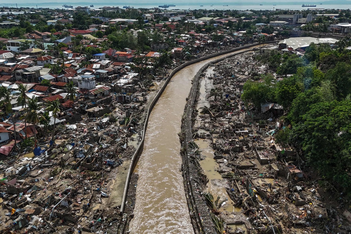 This aerial photo shows damaged houses in the aftermath of Typhoon Kalmaegi in Talisay, in Cebu province on November 5, 2025. Photo by Jam STA ROSA / AFP