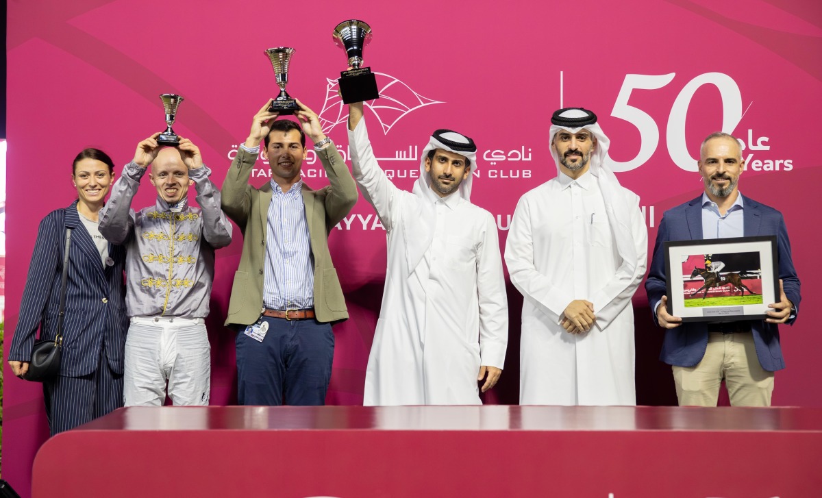 The connections of Al Wakrah celebrate with their trophies. PICS: Juhaim/QREC