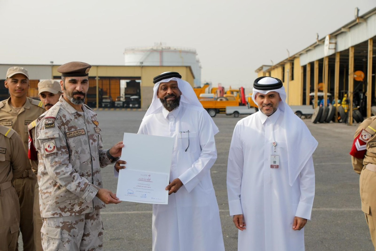 Assistant Undersecretary for Public Services Affairs at the Ministry of Municipality Eng Abdullah Ahmed Al-Karani (right) with other officials during the event.