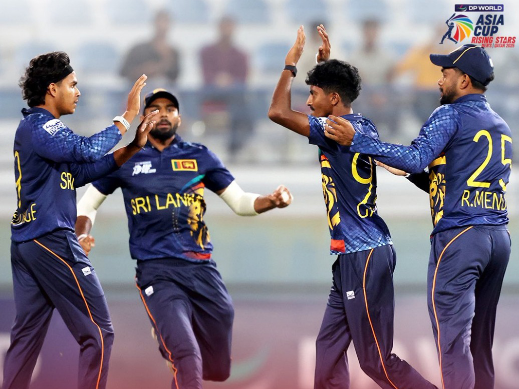Sri Lanka captain Dunith Wellalage (left) celebrates with teammates.