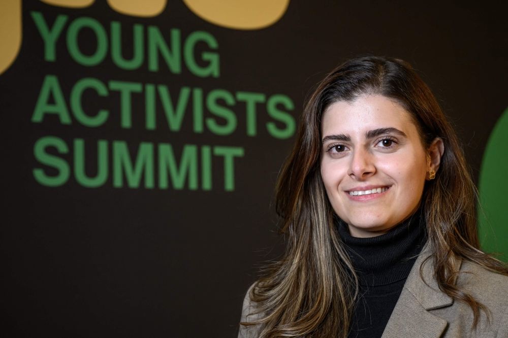 Young activist Lebanon's Marina El Khawand poses on the eve of the Young Activists Summit award ceremony at the UN in Geneva, on November 19, 2025. (Photo by Fabrice Coffrini / AFP)
