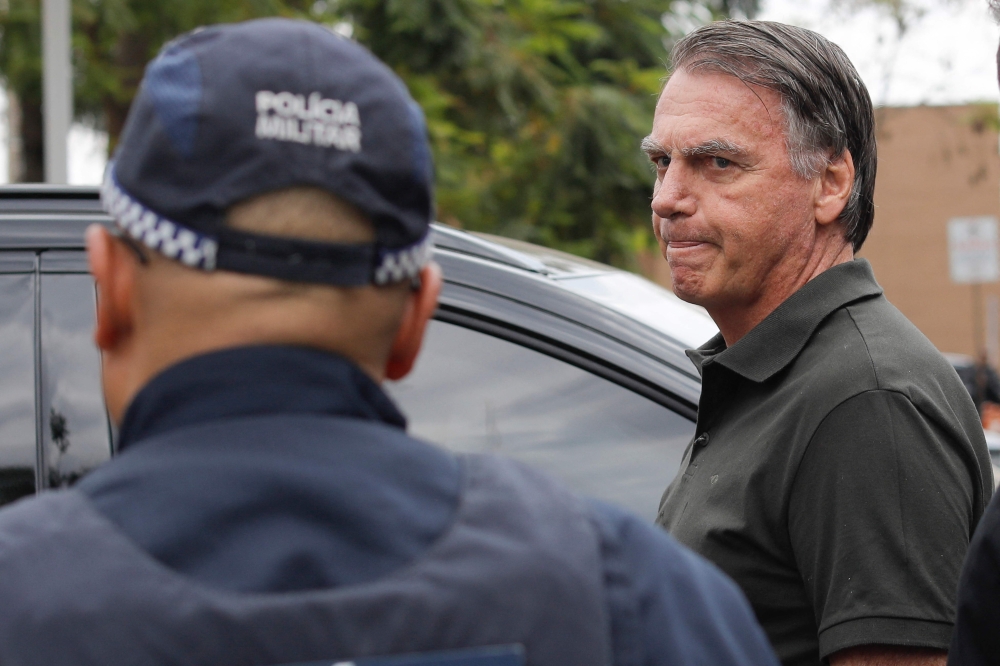 Former Brazilian President (2019-2022) Jair Bolsonaro leaves the DF Star hospital in Brasilia on September 14, 2025, after undergoing a series of medical examinations, as he remains under house arrest. Photo by Sergio Lima / AFP