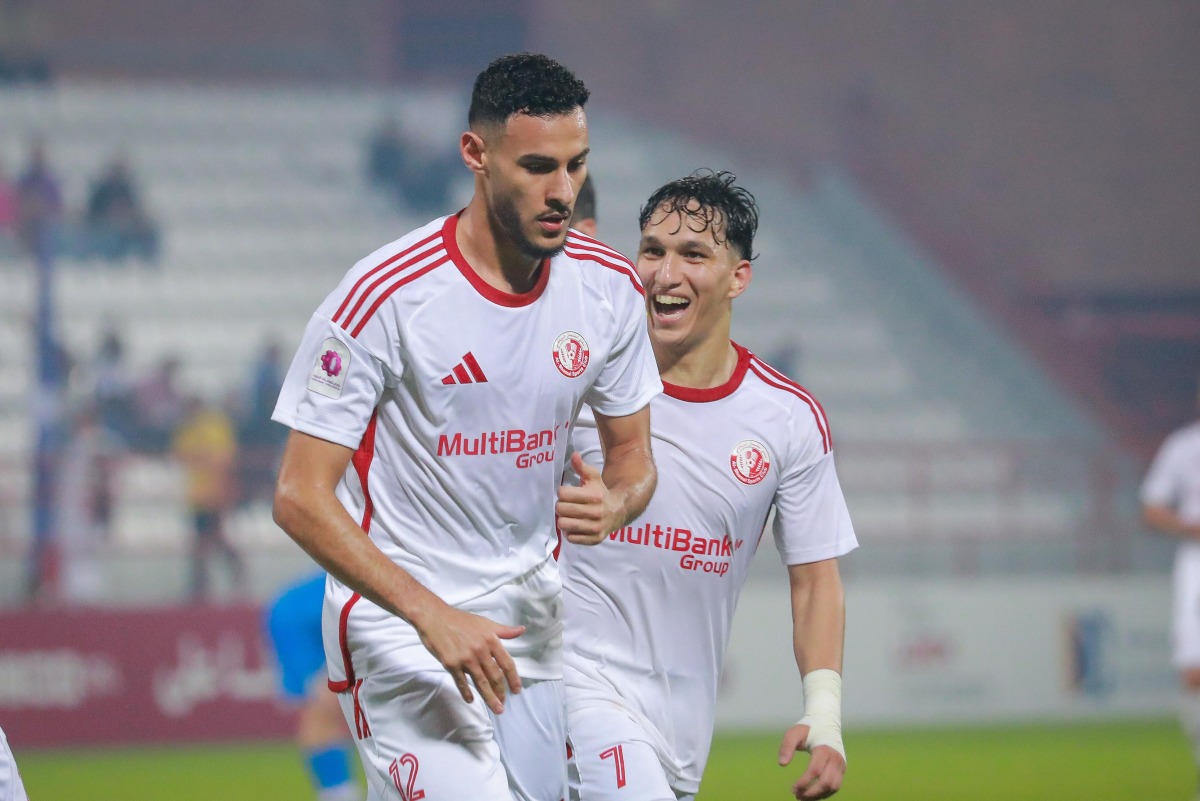 Al Shamal's Mohamed Al-Mannai (left) celebrates with teammate Omar Rafik Mohamed.