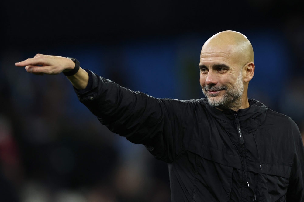 Manchester City's Spanish manager Pep Guardiola acknowledges the crowd at the end of the English Premier League football match between Manchester City and Liverpool at the Etihad Stadium in Manchester, north west England, on November 9, 2025. (Photo by Darren Staples / AFP)

