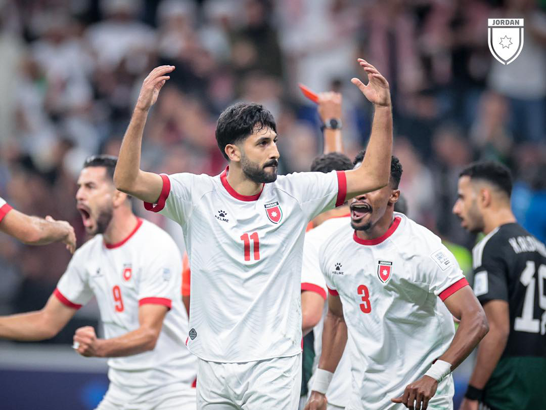 Yazan Al Naimat (centre) celebrates with teammates after scoring Jordan’s second goal.