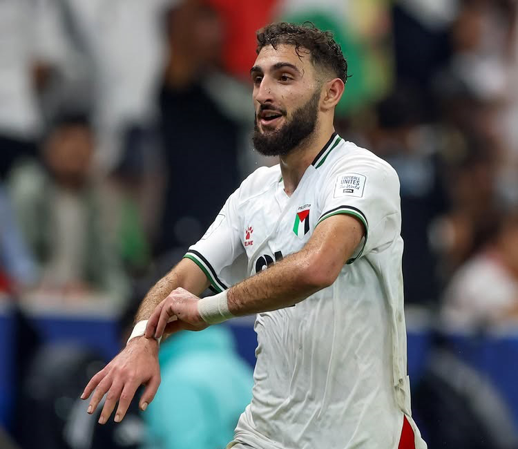 Palestines' Zeid Qunbar celebrates after scoring the equaliser.