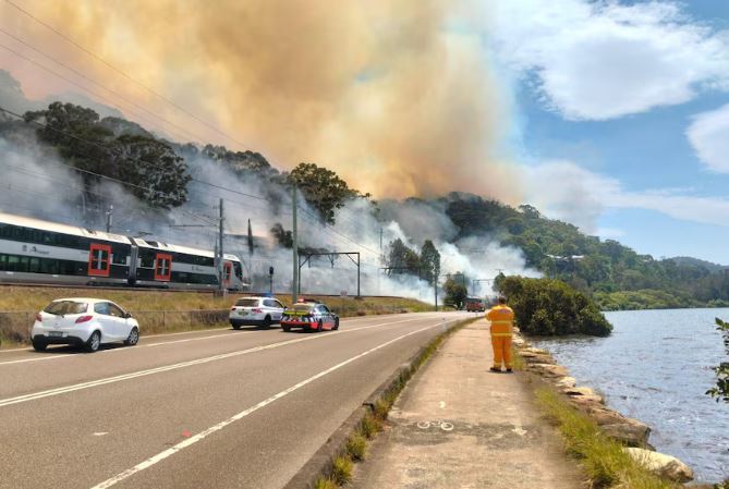 Trains have stopped running on the Central Coast and Newcastle line after a fire broke out on Nimbin Road at Koolewong. (Pics: ABC News)