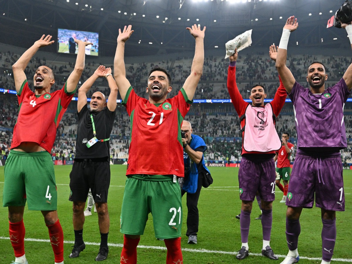 Morocco players celebrate their win over Saudi Arabia yesterday. 
