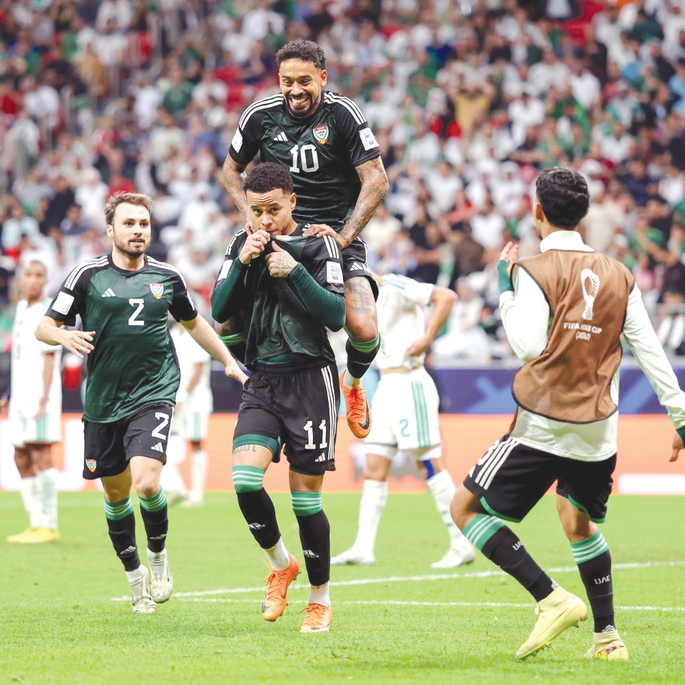 UAE's Bruno Oliveira (second left) celebrates his 64th minute equaliser with teammates. PIC: UAEFA