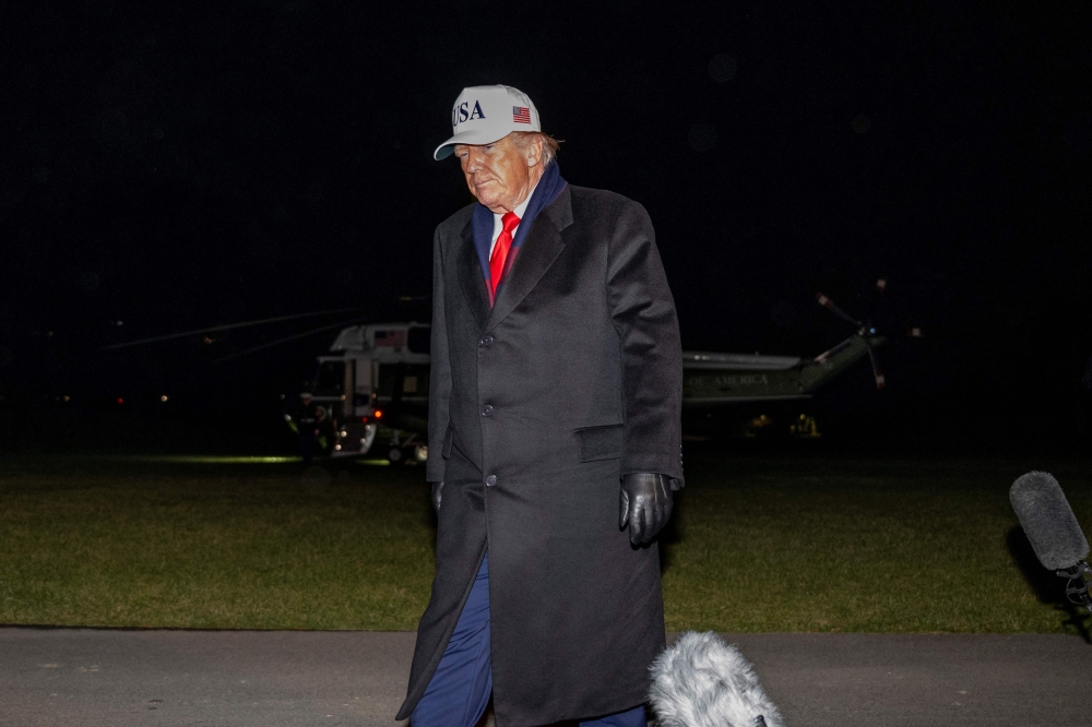 US President Donald Trump walks to the White House residence after speaking to the press on the South Lawn of the White House in Washington, DC, on December 13, 2025. (Photo by Daniel Heuer / AFP)