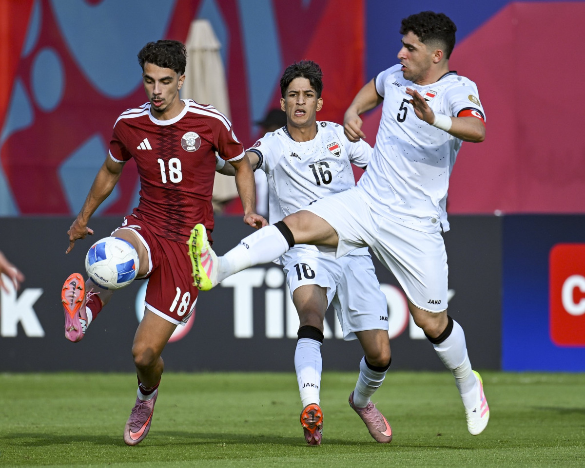 Action during the semi-final between Qatar and Iraq. 