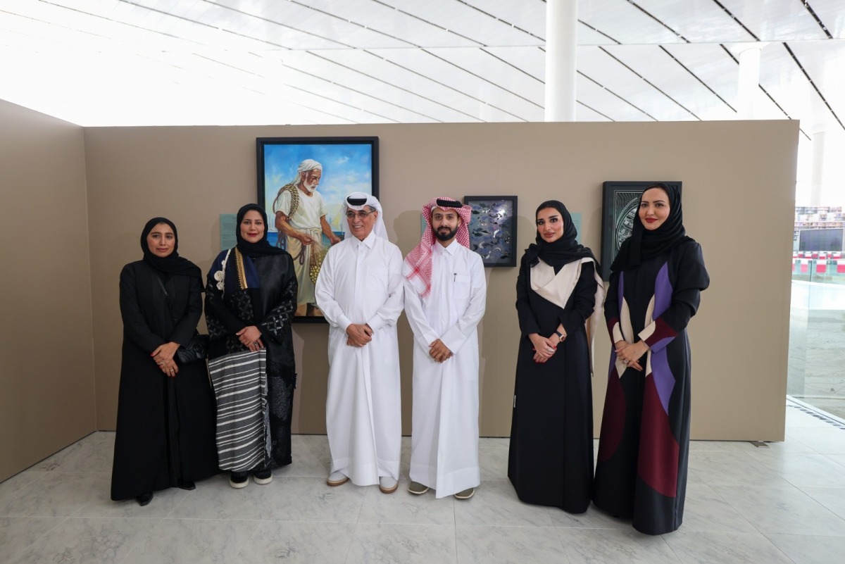 Minister of State and President of Qatar National Library H E Dr. Hamad bin Abdulaziz Al Kawari with artists and Library officials. 