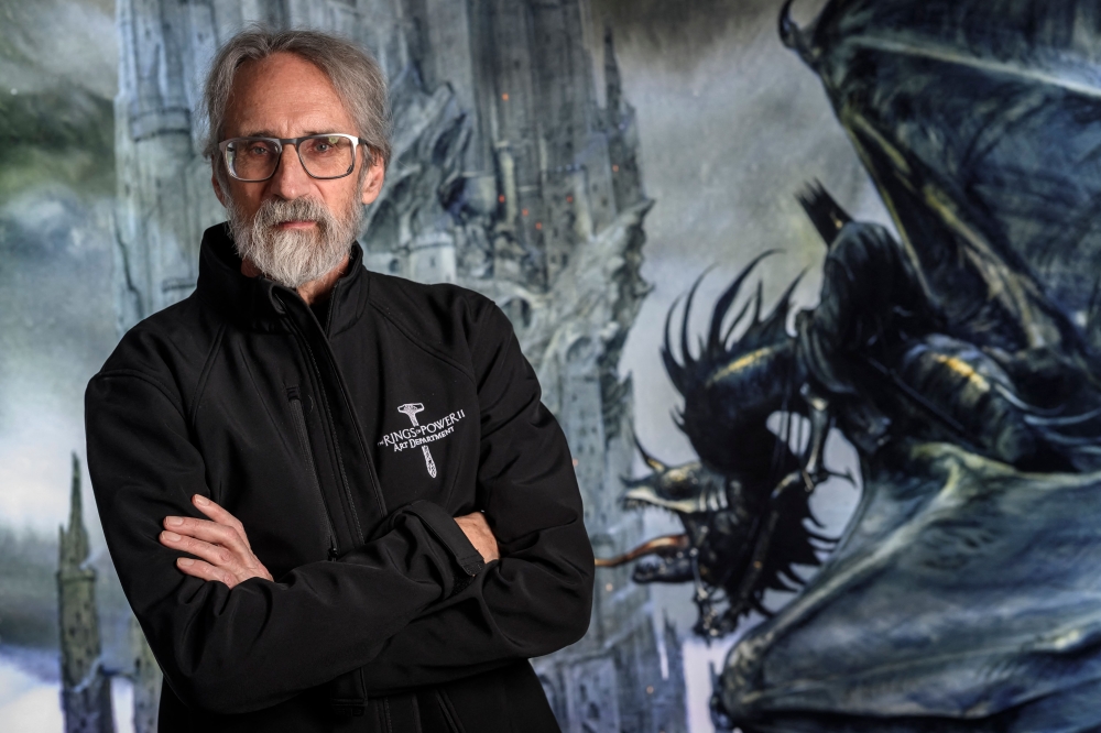 A picture taken in Neuchatel on December 9, 2025 shows illustrator John Howe poses at La Tour du Fantastique (The Tower of the Fantastic) new museum in Neuchatel. (Photo by Fabrice Coffrini / AFP)