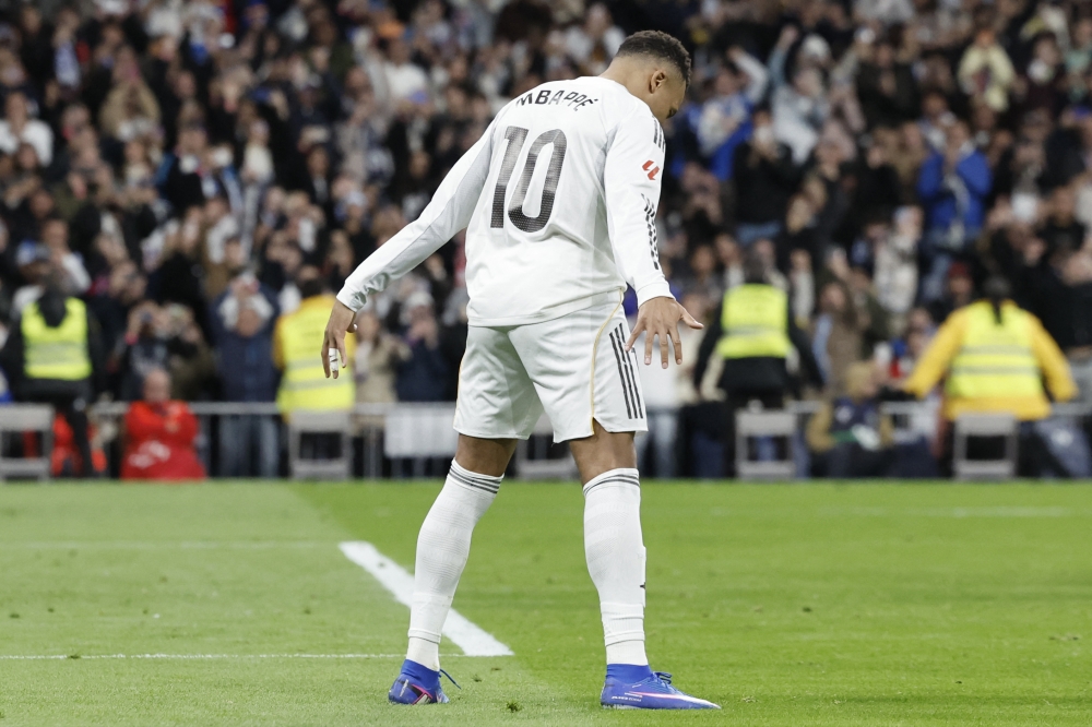 Real Madrid's French forward #10 Kylian Mbappe celebrates scoring his team's second goal at Santiago Bernabeu Stadium in Madrid on December 20, 2025. (Photo by Oscar Del Pozo / AFP)